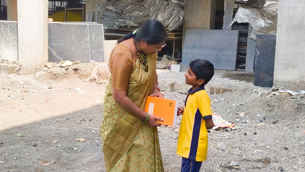 Jai Maa Vaishno Devi Educational Trust Founder distributing educational materials